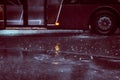 Ukraine. Kiev - 05,12,2019 Spraying water from the wheels of a vehicle moving on a wet city asphalt road. The wet wheel of a car Royalty Free Stock Photo