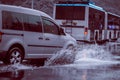 Ukraine. Kiev - 05,12,2019 Spraying water from the wheels of a vehicle moving on a wet city asphalt road. The wet wheel of a car Royalty Free Stock Photo