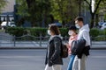 UKRAINE, KYIV - April 25, 2020: Group of people walks on a street wearing a medical masks to prevent of bacterial