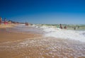 Ukraine, Kyiv - August 4, 2020. View of the beach in Hrybivka, Ukraine, near Odessa tourists, sunbeds and umbrellas on summer hot Royalty Free Stock Photo