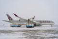 Ukraine, Kyiv - February 12, 2021: De-icing the aircraft before the flight. The deicing machine sprinkles the wing of a