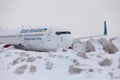 Ukraine, Kyiv - February 12, 2021: Planes at Winter. Aircraft. There is a lot of snow at the airport. Bad weather and visibility. Royalty Free Stock Photo