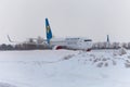 Ukraine, Kyiv - February 12, 2021: Planes at Winter. Aircraft. There is a lot of snow at the airport. Bad weather and visibility. Royalty Free Stock Photo