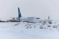 Ukraine, Kyiv - February 12, 2021: Planes at Winter. Aircraft. There is a lot of snow at the airport. Bad weather and visibility. Royalty Free Stock Photo