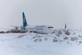 Ukraine, Kyiv - February 12, 2021: Planes at Winter. Aircraft. There is a lot of snow at the airport. Bad weather and visibility. Royalty Free Stock Photo