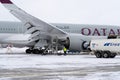 Ukraine, Kyiv - February 12, 2021: Winter airport. A Qatar Airlines plane is being fueled. Refueling the plane. A7-ALW AIRBUS A350