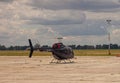 Ukraine, Kyiv - July 8, 2020: The black helicopter is at the airport on the runway. Private transport air damage in the parking