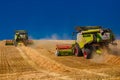 Ukraine. Kyiv. JULY 23, 2022: Modern combine Claas Lexion harvesting grain in the field.Combine harvest on grain field.