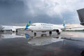 Rainy weather at the airport. Passengers plane Boeing 737-900ER UR-PSK on the Boryspil airport apron runway. Ukraine