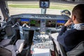 Ukraine, Kyiv - October 29, 2019: Airplane cockpit aircraft -Embraer. Plane instrument panel. Pilot seat. Night.