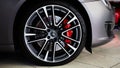 Ukraine, Kyiv - October 10, 2021: Closeup wheel with red brake discs. Presentation of new models Maserati