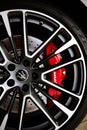 Ukraine, Kyiv - October 10, 2021: Closeup wheel with red brake discs. Presentation of new models Maserati