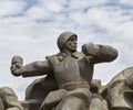 Ukraine, Kyiv. A sculpture of a soldier throws a grenade.