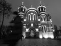 A black and white scene of a church and a pedestrian in Kyiv - UKRAINE - KYIV Royalty Free Stock Photo