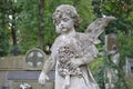 Ukraine, Lviv, Lychakivskiy Cemetery-September 26, 2011: Stone monument statue in the shape of an angel with flowers Royalty Free Stock Photo