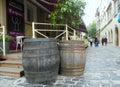 Ukraine, Lviv, Staroyevreyska street, wooden barrels near the bar