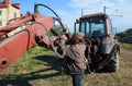 UKRAINE - MAY 06, 2017: The electric welder repairs the excavator by welding.