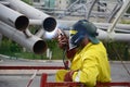 Welding works on welding of metal structures. An electric welder works on scaffolding. Royalty Free Stock Photo