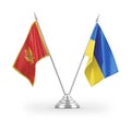 Ukraine and Montenegro table flags isolated on white 3D rendering