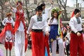 Ukraine, Odessa - April 1, 2019: A colorful group of street dancers on stilts in Ukrainian costumes.Parade of laughter and humor,