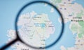 UKRAINE, ODESSA - APRIL 25, 2019: Northern Ireland on google maps through magnifying glass.