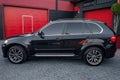 Ukraine, Odessa July 8 - 2021: Black compact crossover BMW X5 on the empty parking, side view