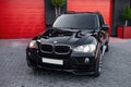 Ukraine, Odessa July 8 - 2021: Black compact crossover BMW X5, front view. Photography of a modern car on a parking. Royalty Free Stock Photo