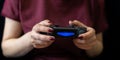 Ukraine, Odessa - July 2, 2019: A girl plays a video game on a playstation 4 joystick. The ps4 gamepad is in the girlÃ¢â¬â¢s hands. Royalty Free Stock Photo