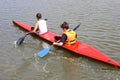 Ukraine, Odessa, summer 2019. A coach teaches a young guy how to control a kayak on a rowing canal