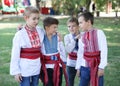 Ukraine, Pokrov - August 23, 2019: National Flag Day Celebration. Four boys friends dressed in folk Ukrainian embroidered shirts
