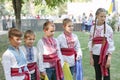 Ukraine, Pokrov - August 23, 2019: National Flag Day Celebration. Four boys and a girl dressed in folk Ukrainian embroidered