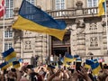 Ukraine President Volodymyr Zelenskiy is received by an enthusiastic audience with flags