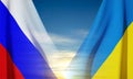 Ukraine and Russia flags on blue sky