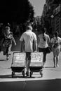 Ukraine,Shostka-August 24, 2019: A man rolls carts. On one is written: Find out what the Bible teaches Royalty Free Stock Photo