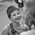 Ukraine, Shostka - August 24, 2019: Smiling boy with first molar