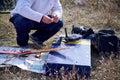 Ukraine, Shostka - October 12, 2019: The man prepare the transmitter of the radio-controlled model of rocket plane
