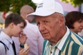 Ukraine, Shostka - September 3, 2019: Portrait of an elderly man in a striped shirt and cap that says - I`m not perfect