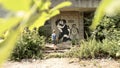 Ukraine, summer 2023. A guy looks at graffiti on a wall in an alley, which depicts a couple in love