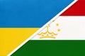 Ukraine and Tajikistan, symbol of country. Ukrainian vs Tajikistani national flags