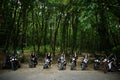 Ukraine, Tarnopol - September 8, 2018: Group of young girls at hen party on choppers and wear black leather dress. Biker Woman on