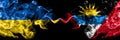 Ukraine, Ukrainian vs Antigua and Barbuda, Antiguan and Barbudan smoky mystic flags placed side by side. Thick colored silky