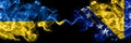 Ukraine, Ukrainian vs Bosnia and Herzegovina, Bosnian, Herzegovinian smoky mystic flags placed side by side. Thick colored silky