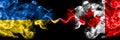 Ukraine, Ukrainian vs Canada, Canadian smoky mystic flags placed side by side. Thick colored silky abstract smokes flags Royalty Free Stock Photo