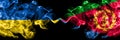 Ukraine, Ukrainian vs Eritrea, Eritrean smoky mystic flags placed side by side. Thick colored silky abstract smokes flags