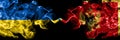 Ukraine, Ukrainian vs Montenegro, Montenegrin smoky mystic flags placed side by side. Thick colored silky abstract smokes flags