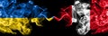 Ukraine, Ukrainian vs Peru, Peruvian smoky mystic flags placed side by side. Thick colored silky abstract smokes flags