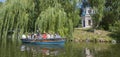 Ukraine - Uman, Sofiyivka Park - June 10, 2017: Tourists float on a boat to enjoy the lively landscapes.