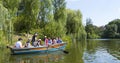 Ukraine - Uman, Sofiyivka Park - June 10, 2017: Tourists float on a boat to enjoy the lively landscapes.