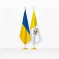 Ukraine and Vatican City flags on flag stand, illustration for diplomacy and other meeting between Ukraine and Vatican City