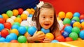 Ukraine Vinnitsa 09 27 2023 Girl with Down syndrome playing with geometrical shapes Royalty Free Stock Photo